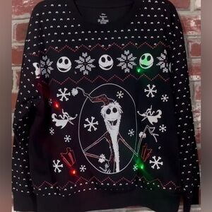 Like New: Disney’s Tim Burton sweatshirt with dancing lights. Unisex size L.